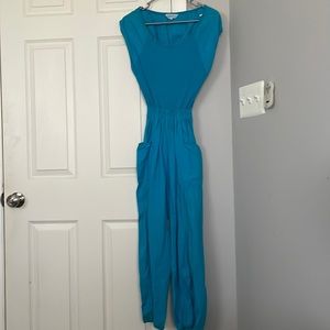 Vintage 80s turquoise jumpsuit. Cute back cutout